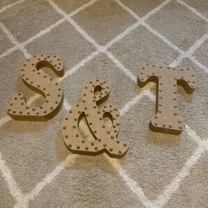 Wooden S T & letters with burlap and gold buttons.